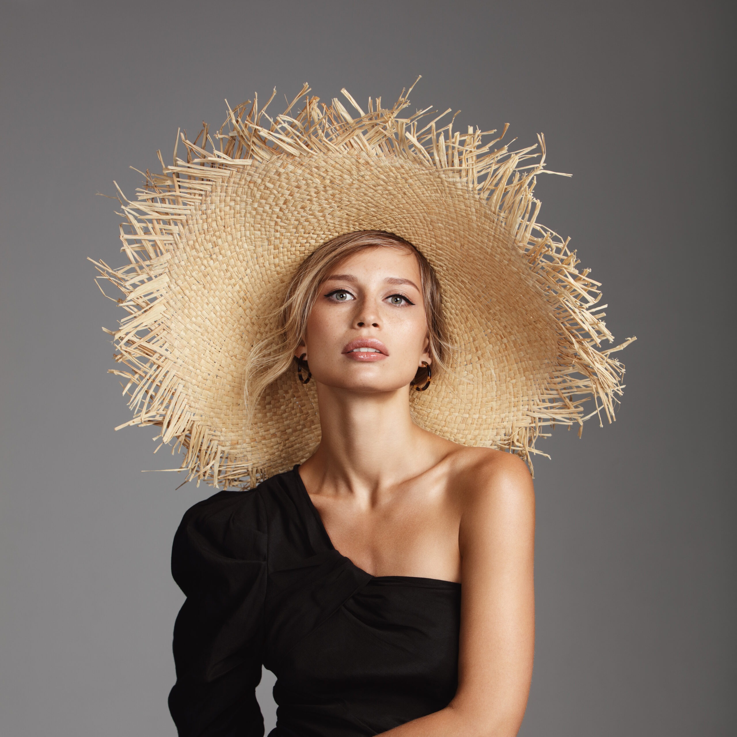 Beautiful woman wearing straw hat